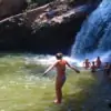swimming at waterfall