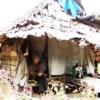 elder woman small bamboo hut