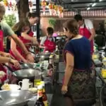 group of people learning thai cooking