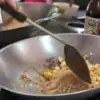 cooking pad thai in a wok