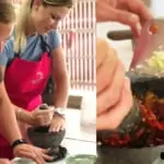 close of of women making curry paste with mortar and pestle