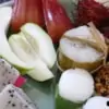 close up of tropical fruits and snacks