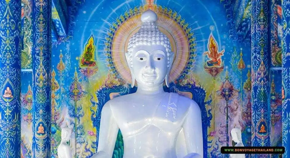 buddha statue inside blue temple wat rong seua ten