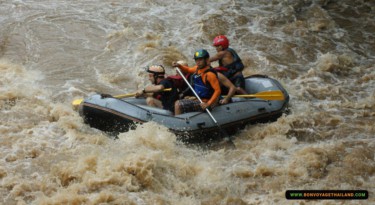 group of people whitewater rafting