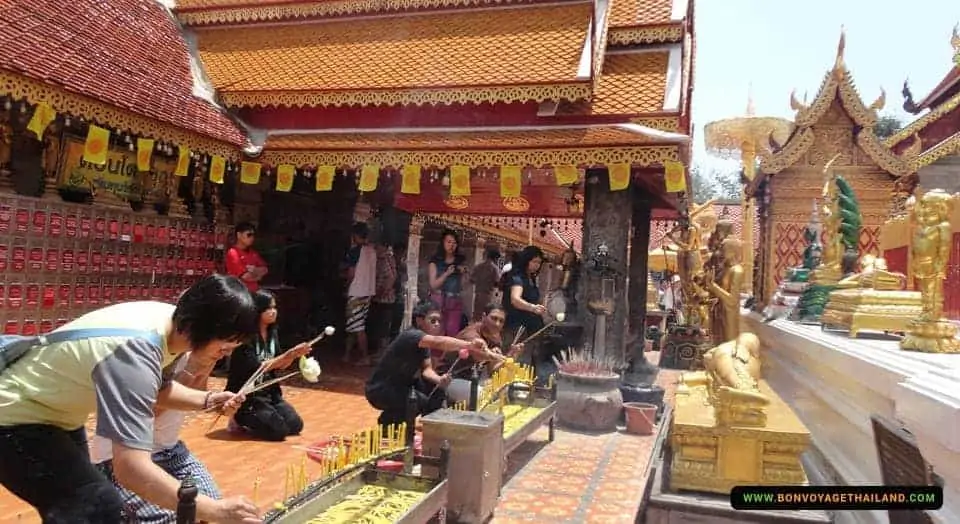 people making merits at doi suthep temple