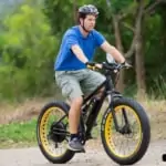 man riding on e-bike on hill