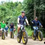 group of people riding on e-bikes