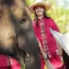 close up of woman bonding with elephant