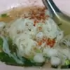 a bowl of traditional thai noodle soup