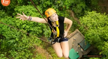 woman ziplining at jungle flight