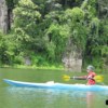 young man kayaking through a lake