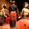 thai classical dance performance with umbrellas