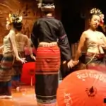 thai classical dance performance with umbrellas