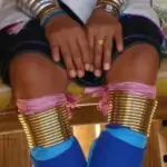 close up of golden rings on knees