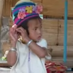 long neck karen child in traditional costume