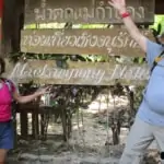 couple posing in front of mae kampong waterfall