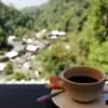 view of cup of coffee overlooking mae kampong village