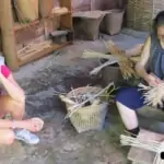 elder woman making basket from bamboo
