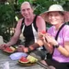 couple enjoy tropical fruits