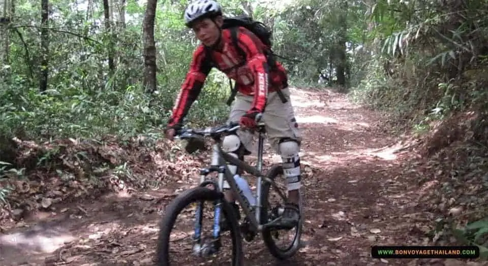 young man mountain biking