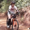 young woman mountain biking