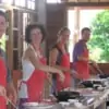 men and women cooking authentic thai food