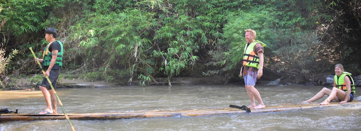 traditional thai rafting along a river