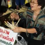 local vendor selling sticky rice in bamboo