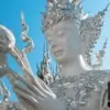 close up of buddha statue at white temple (wat rong khun) in chiang rai