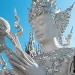 close up of buddha statue at white temple (wat rong khun) in chiang rai