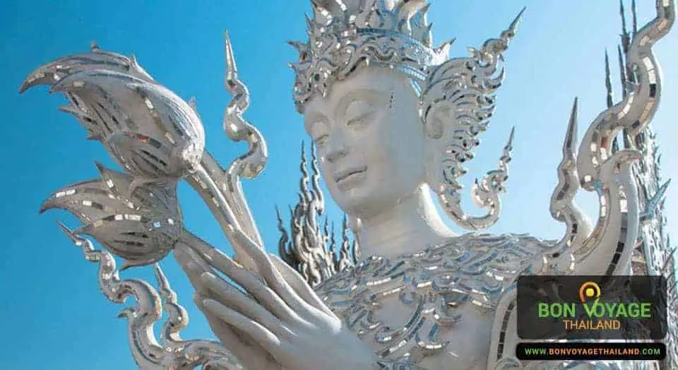 close up of buddha statue at white temple (wat rong khun) in chiang rai