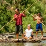 traditional bamboo rafting along river