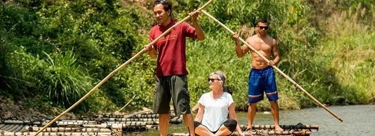 traditional bamboo rafting along river