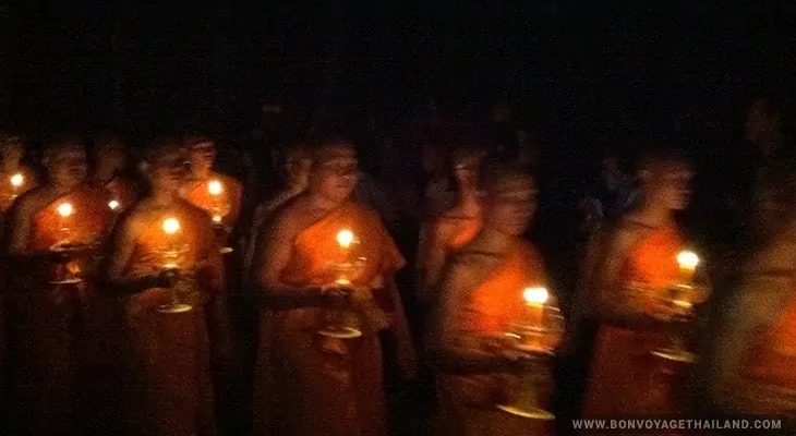 monks holding candles during yeepeng festival