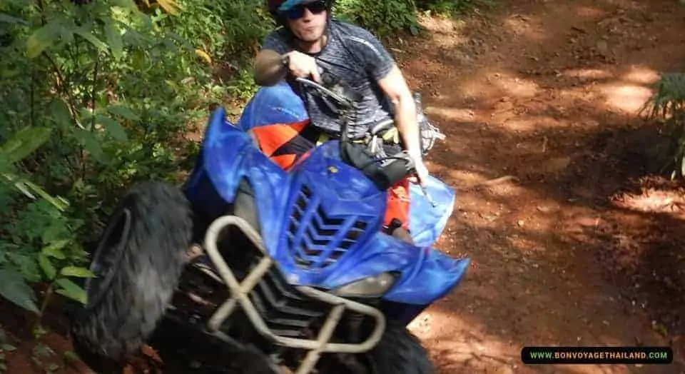 man enjoying driving atv through nature