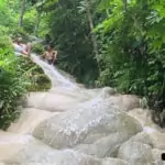 Sticky Waterfall with people at the top