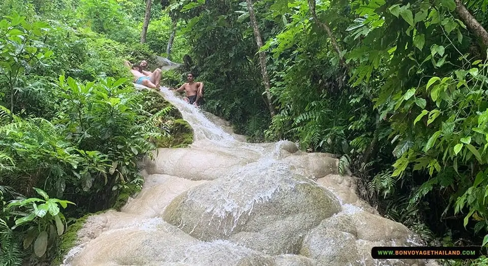 Sticky Waterfall with people at the top