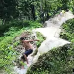 Sticky Waterfall with people at the top