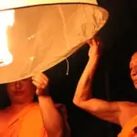Monks floating a lantern